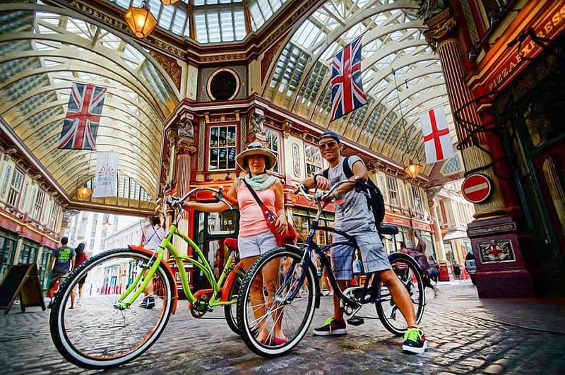 Two people on bikes in Leadenhall Market London