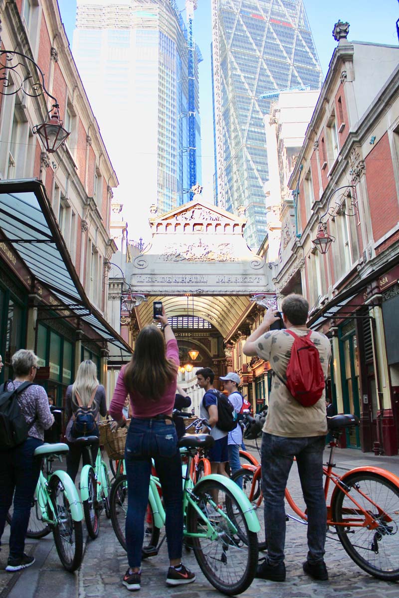 A group on a BrakeAway bike tour marvelling at London’s high-rise skyline